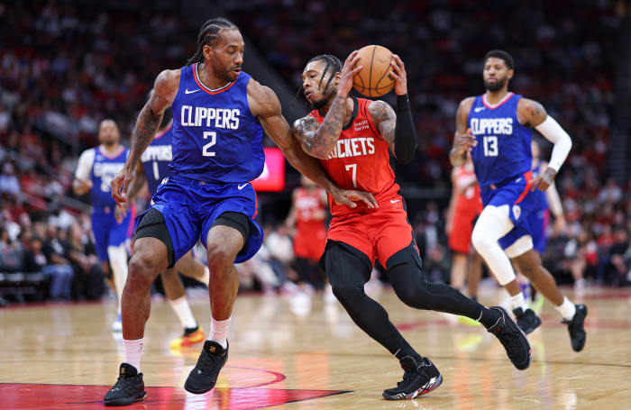 Rockets forward Cam Whitmore (7) drives with the ball as Los Angeles Clippers forward Kawhi Leonard (2) defends during the second quarter at Toyota Center